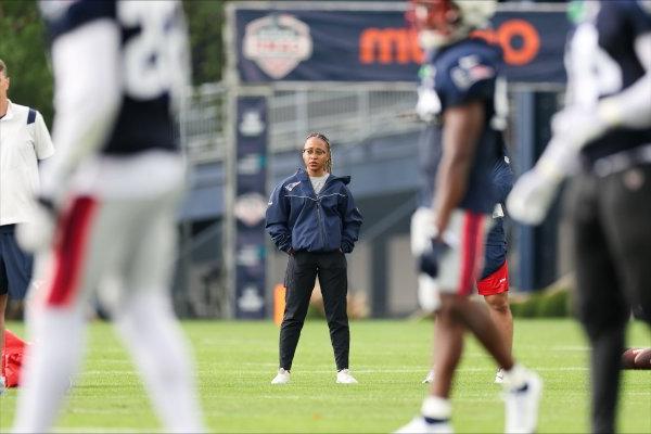 Maya Ana Callender on the field with the New England Patriots.